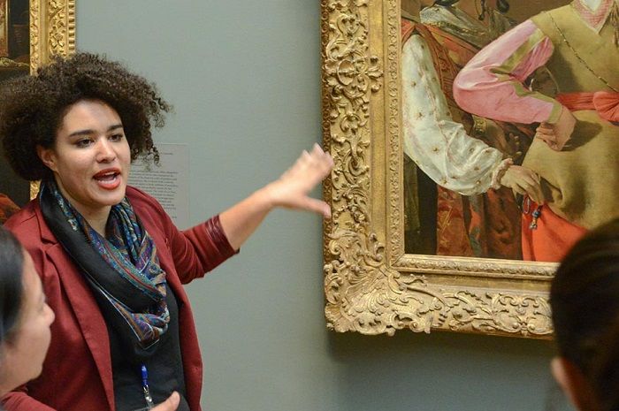 Educator speaks to group in European Paintings gallery