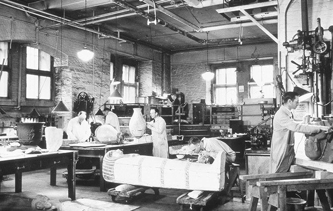 Objects conservators working in the Museum's repair shop in 1936