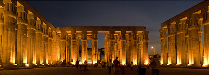 View of the Luxor Temple at night with its columns illuminated